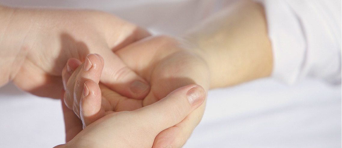 a doctor checks the skin on the hands of a patient to ensure there are no skin disorders to be addressed